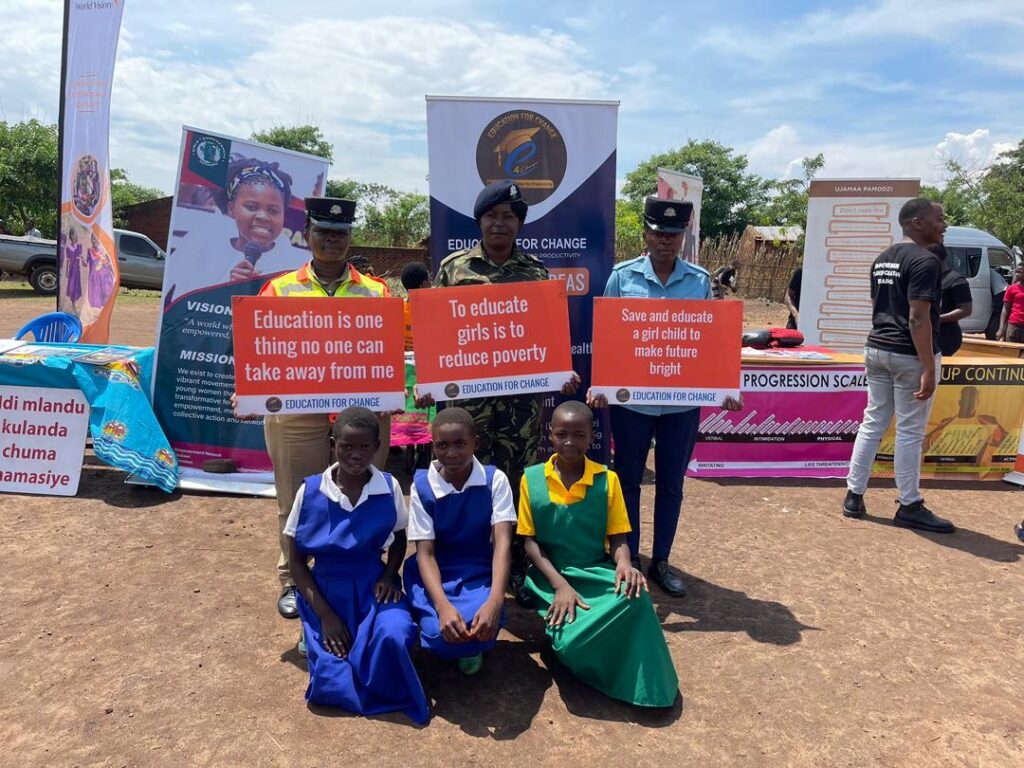 Police Officers standing in solidarity with young girls to combat gender-based violence